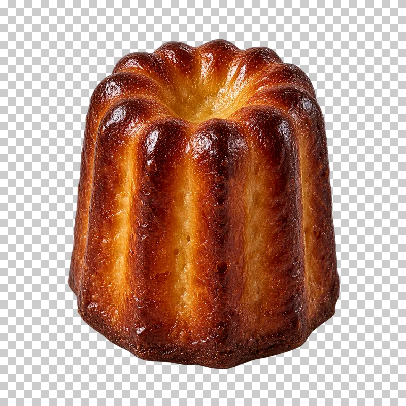 A Bordeaux canelé with deep caramelized ridges and a fluted cylindrical shape.
