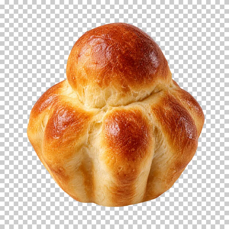 A golden brioche à tête with a small round top bun and a fluted base.