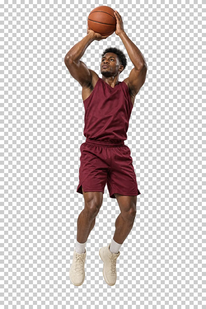 A man in a burgundy basketball uniform jumping with a ball above his head.