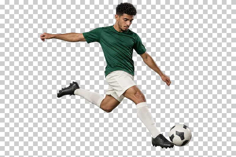 A man in a forest-green shirt and ivory shorts swinging his leg to kick a football.