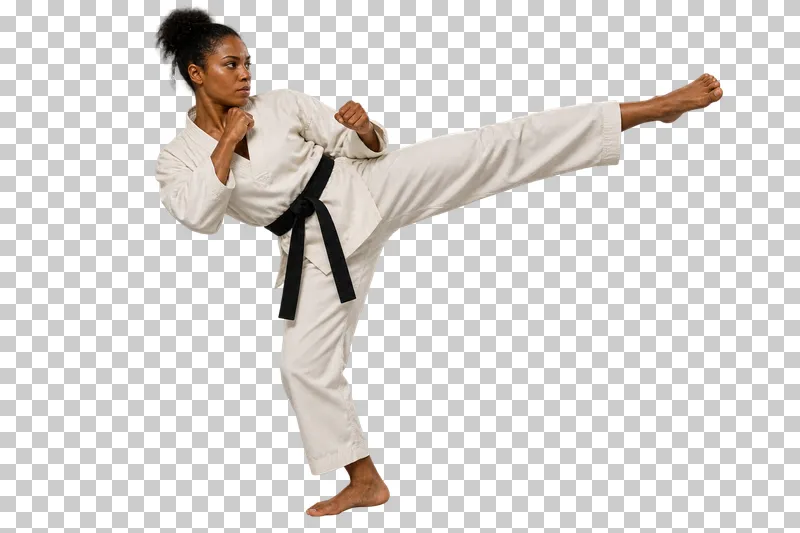 A woman in an ivory taekwondo uniform and black belt extending a high side kick.