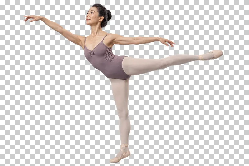 A woman in a mauve leotard and cream tights balancing in a ballet arabesque.