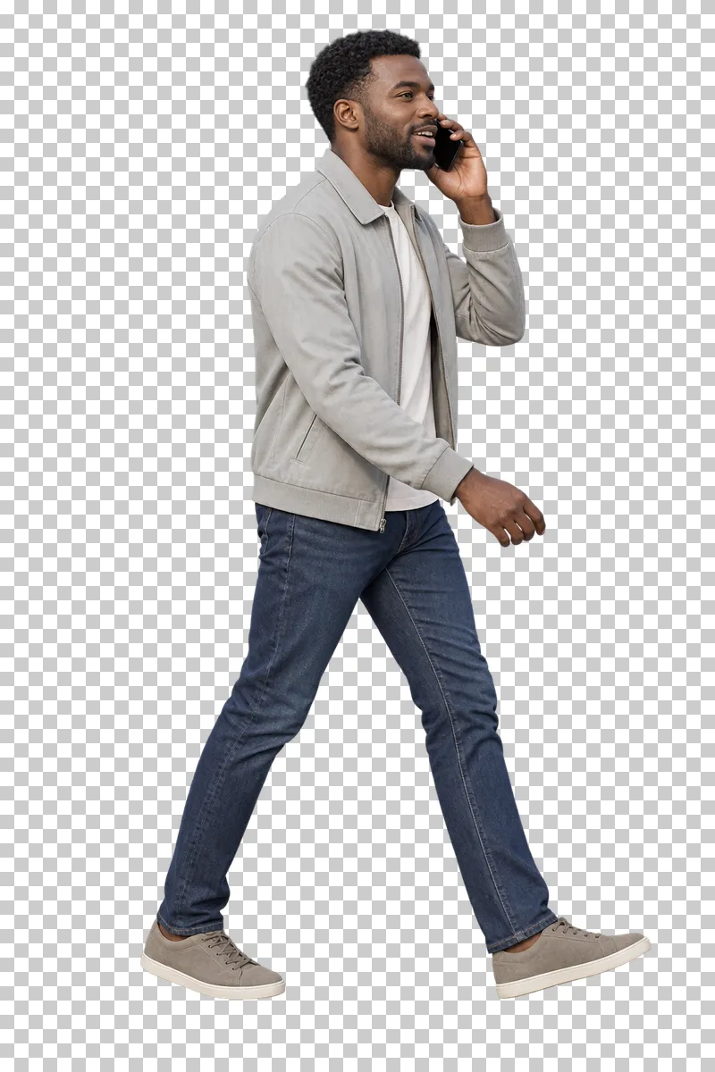 A man talking on a phone in everyday clothing.