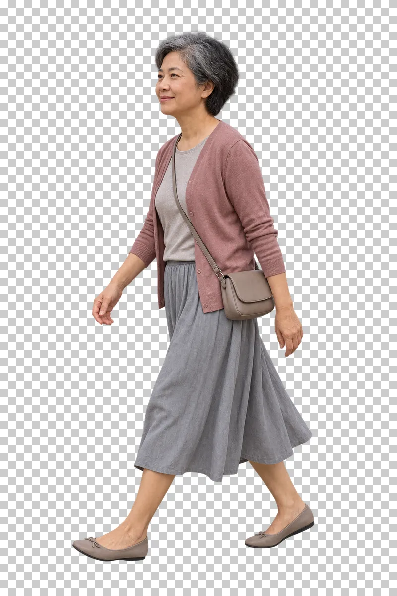 A woman walking with a crossbody bag.