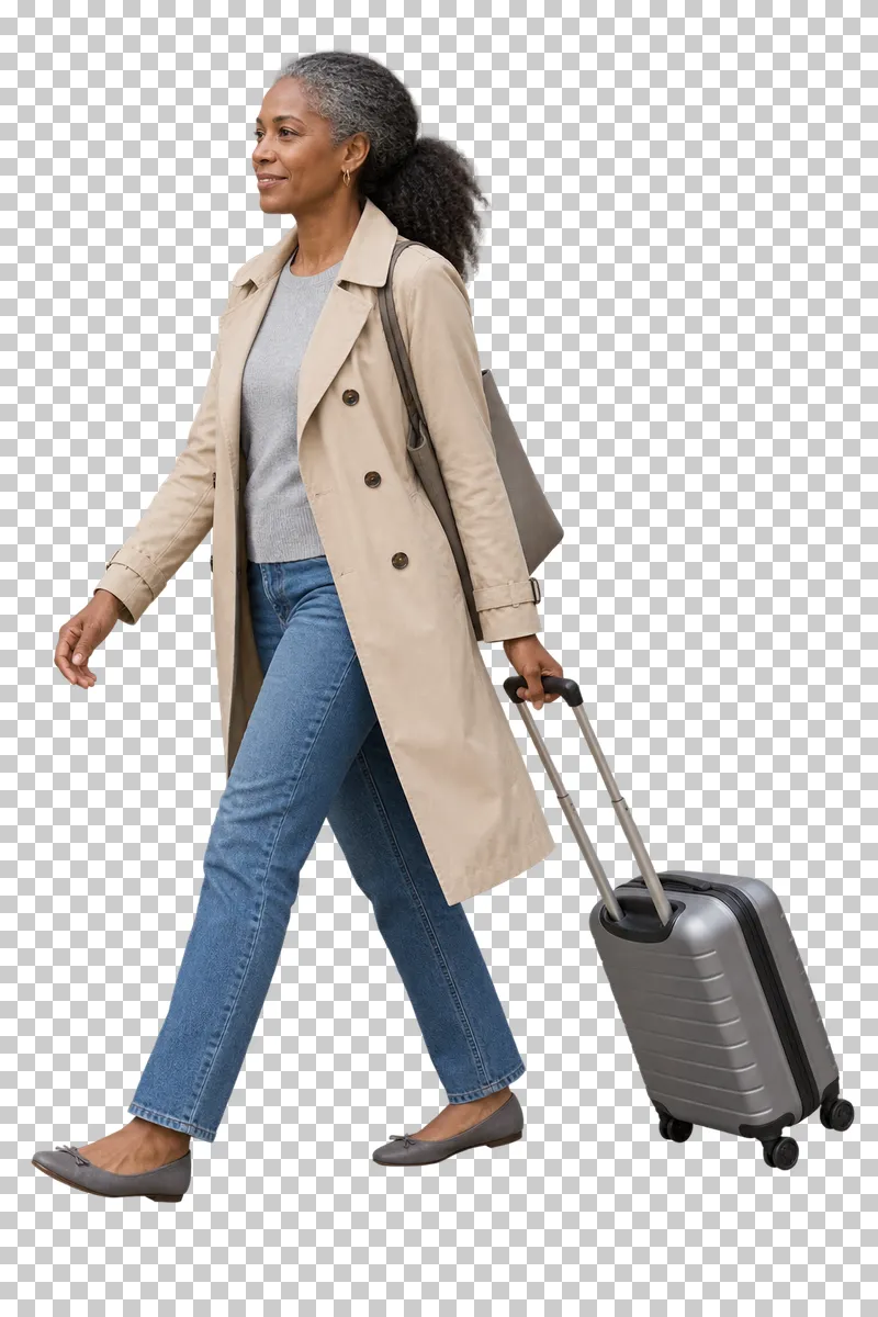 A woman walking with a travel suitcase.