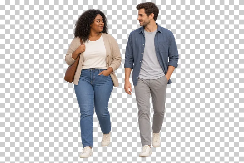 A woman in a beige cardigan holding her bag strap while walking and talking with a man in a blue overshirt.