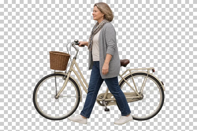A woman in a gray cardigan walking beside a cream bicycle with a front basket.