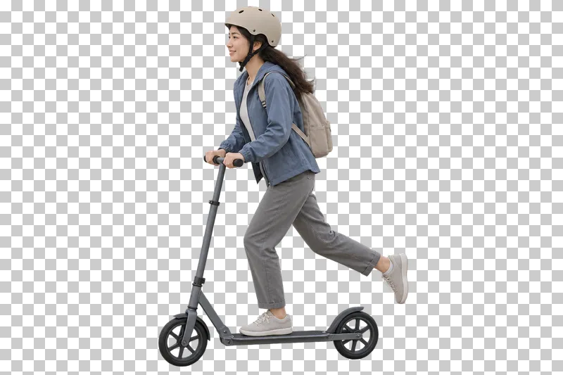 A woman wearing a helmet and blue jacket riding a kick scooter.