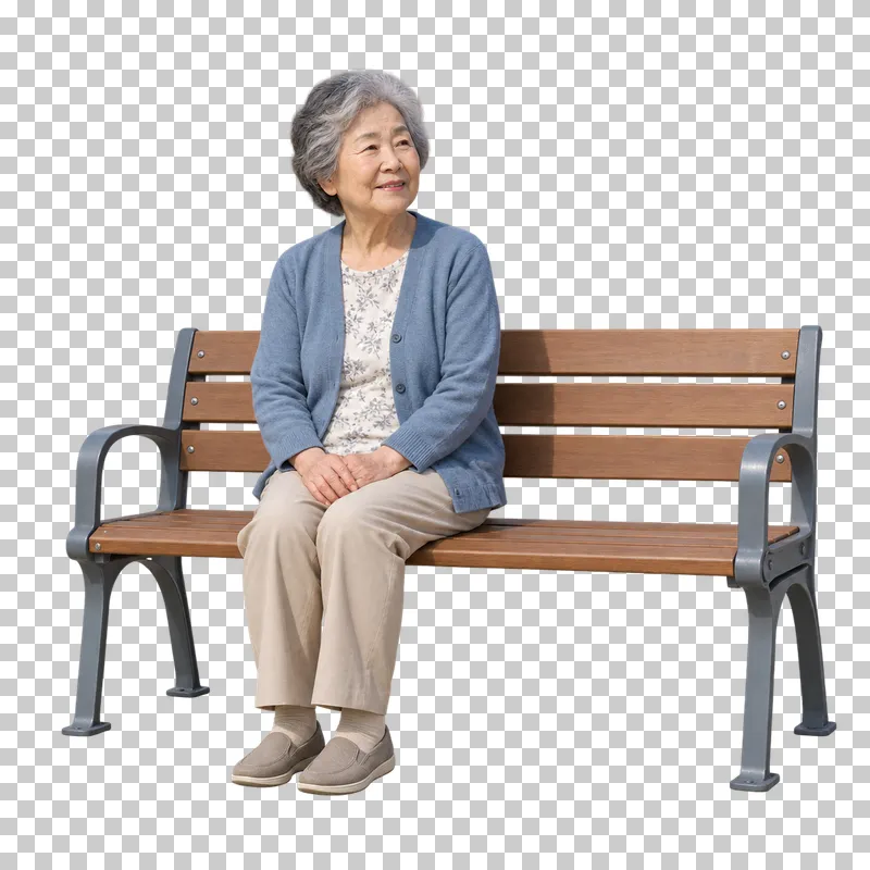A senior woman in a blue cardigan and beige trousers resting on a wooden bench.