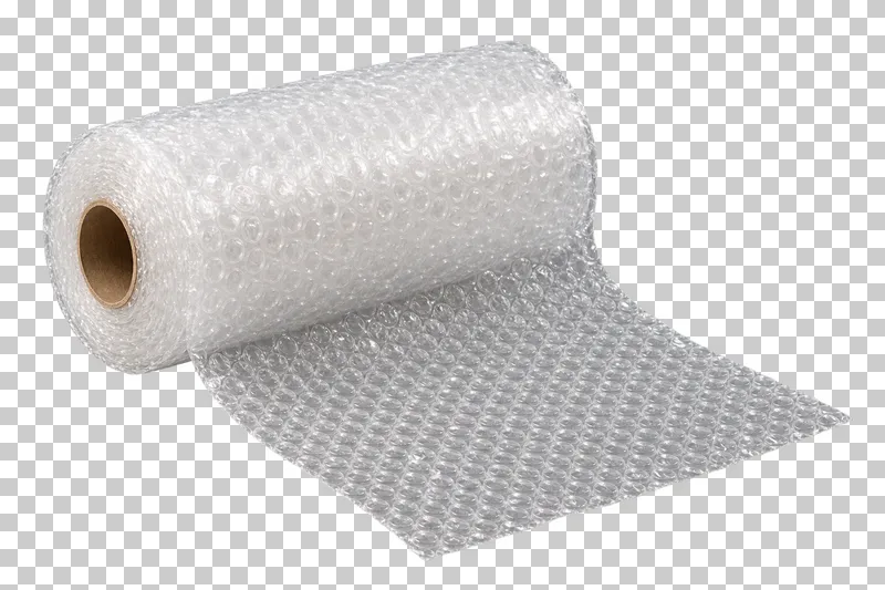 A roll of clear bubble wrap around a kraft core with a short sheet unrolled toward the front.