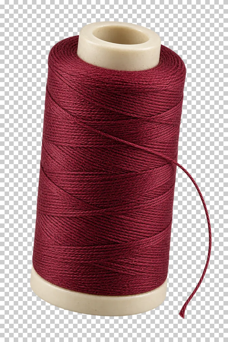 Burgundy cotton sewing thread wound around a cream plastic spool.