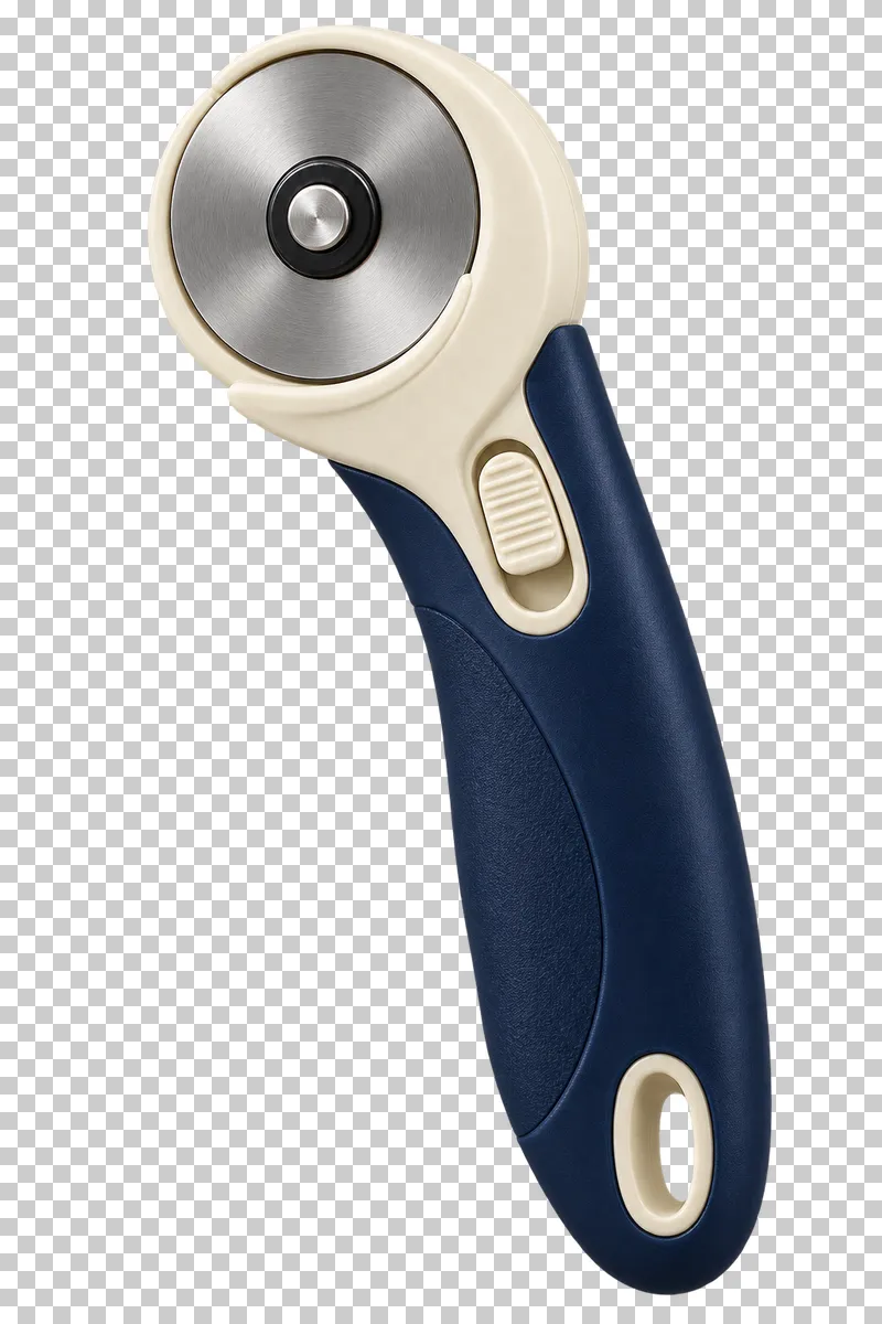 A navy and cream rotary fabric cutter with its blade edge covered by a safety guard.