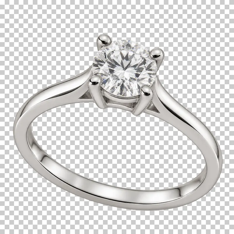 A silver solitaire ring with one clear round stone held by four prongs.