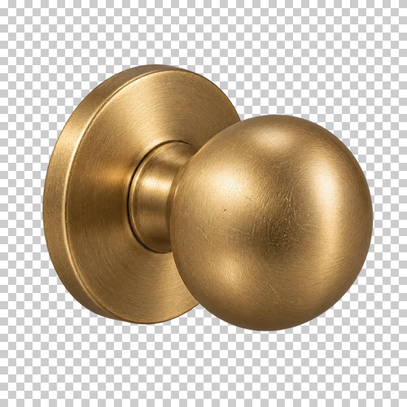 A round brass door knob attached to a circular rose.