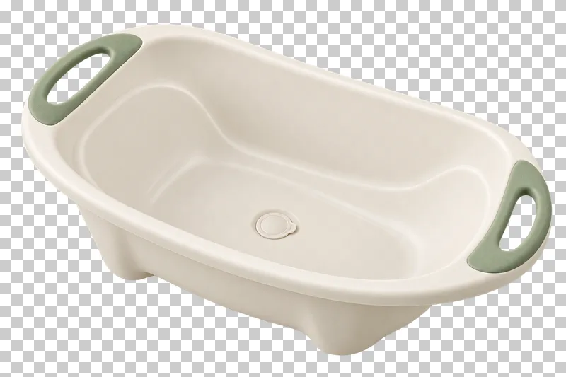 Cream baby bathtub with sage handle grips, a rounded rim and a drain plug.