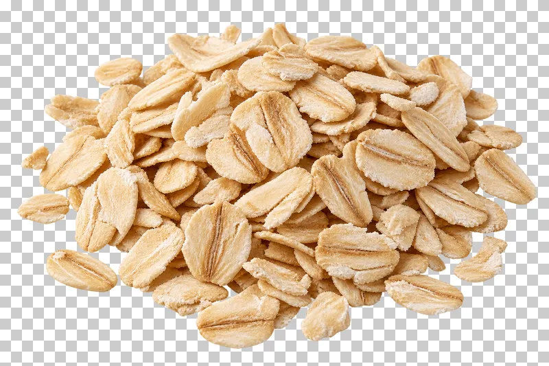 A small mound of rolled oats with pale flattened flakes and uneven dry edges.