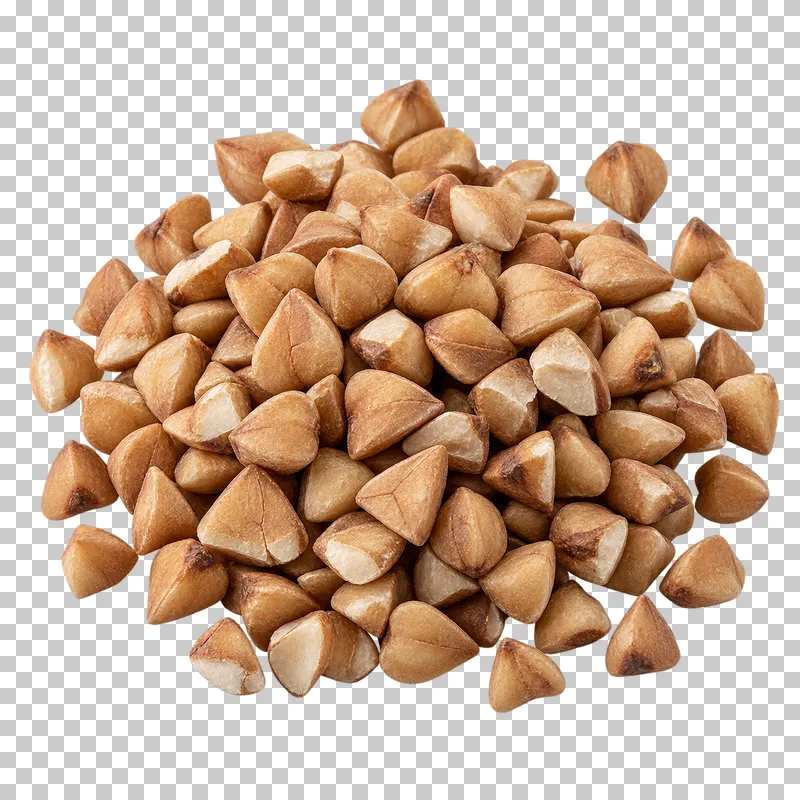 A small mound of buckwheat groats with angular triangular kernels in varied brown shades.
