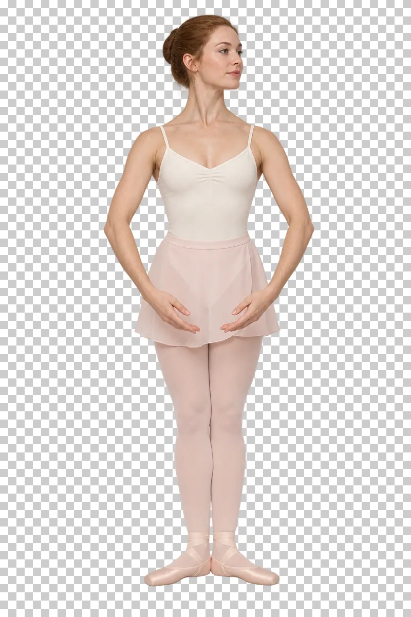 Full-length ballet dancer in an ivory leotard and pink tights standing in first position with rounded arms.