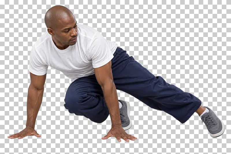 Male breaking dancer in a white T-shirt and navy trousers performing low six-step footwork.