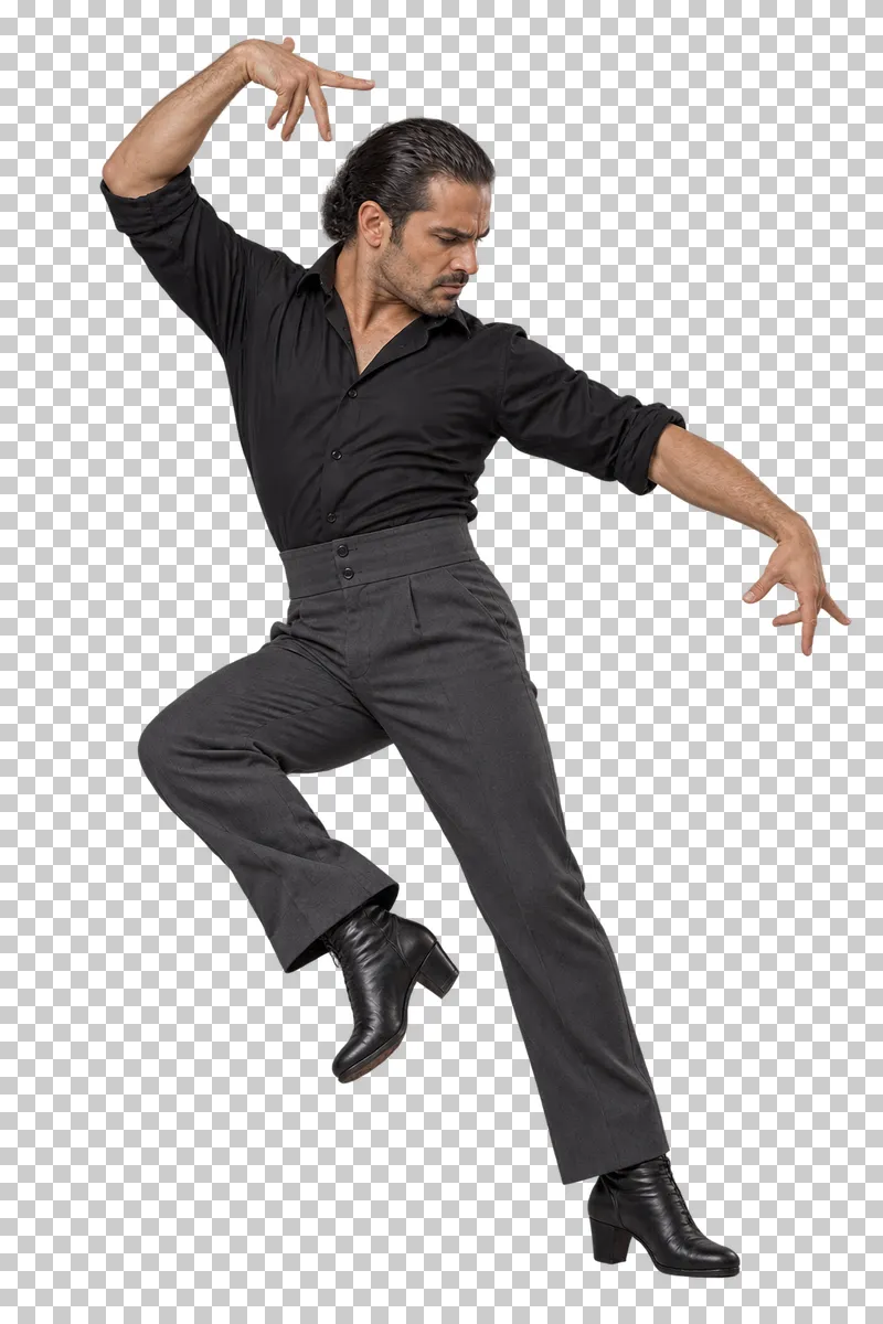 Male flamenco dancer in a black shirt and charcoal trousers preparing a controlled heel strike.