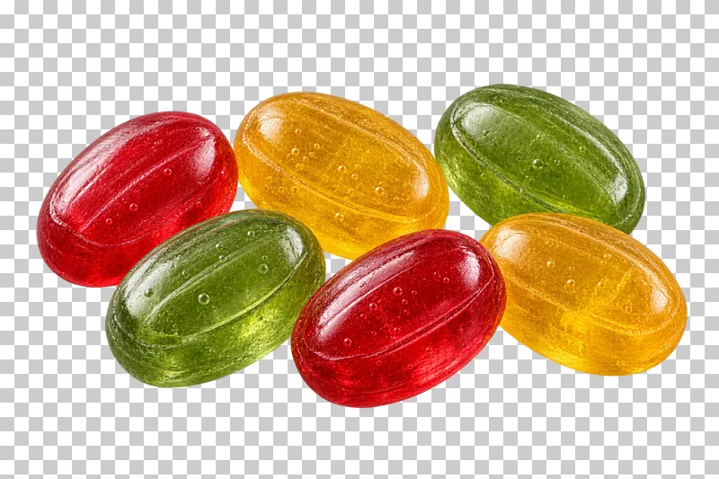 A small portion of red, golden and green oval fruit hard candies with tiny trapped bubbles.