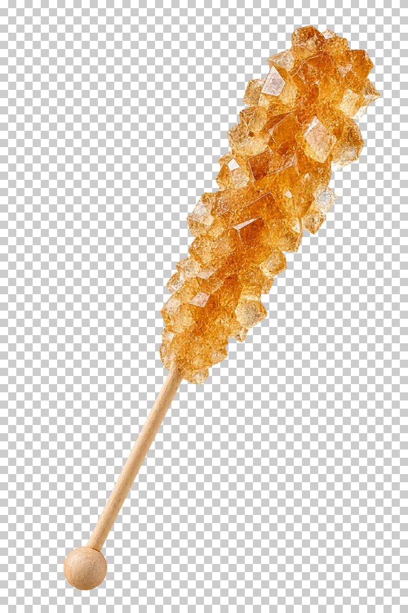 A wooden stick covered in pale amber rock-sugar crystals with varied angular facets.