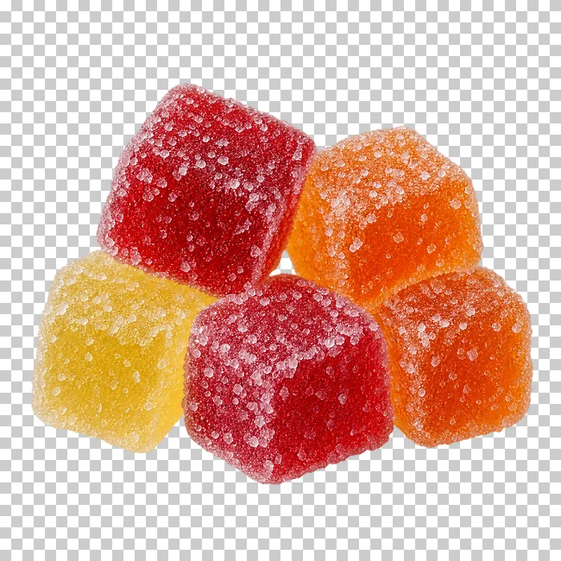 A small portion of red, orange and yellow jelly cubes covered in visible sugar crystals.