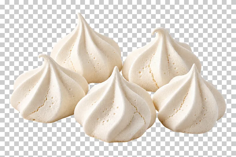 A small portion of ivory meringues with piped ridges, varied peaks and tiny natural cracks.