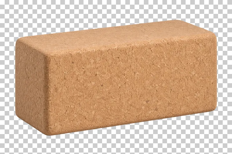 A rectangular cork yoga block with rounded edges and natural cork texture.