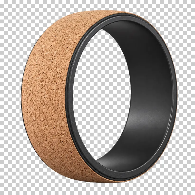 A yoga wheel with a cork outer surface and dark inner frame.