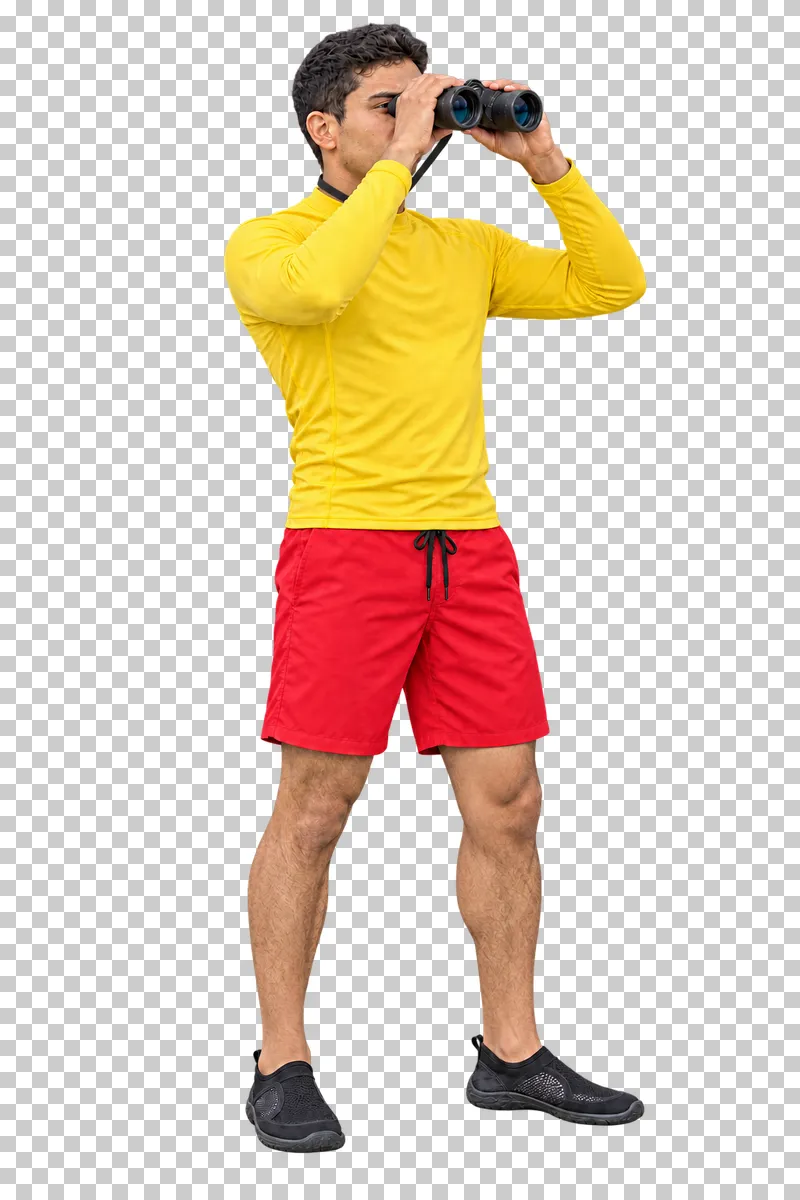 Male water rescuer in a yellow UV top and red swim shorts looking through binoculars, isolated on a transparent background
