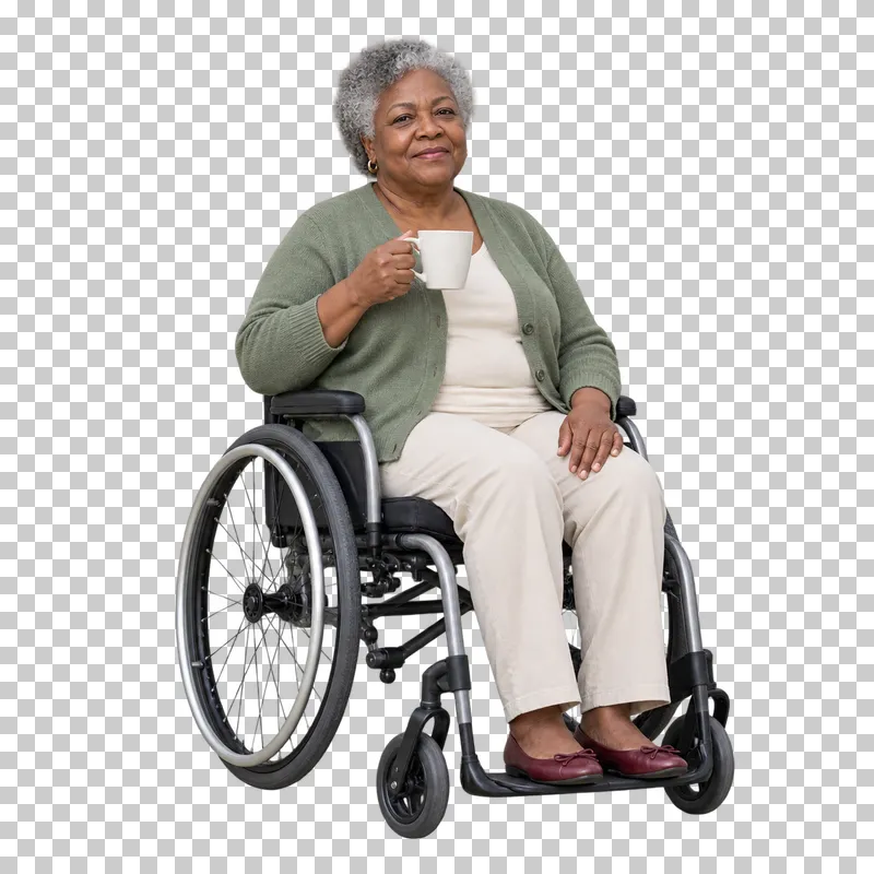 An older woman holding a cup while seated in a wheelchair.