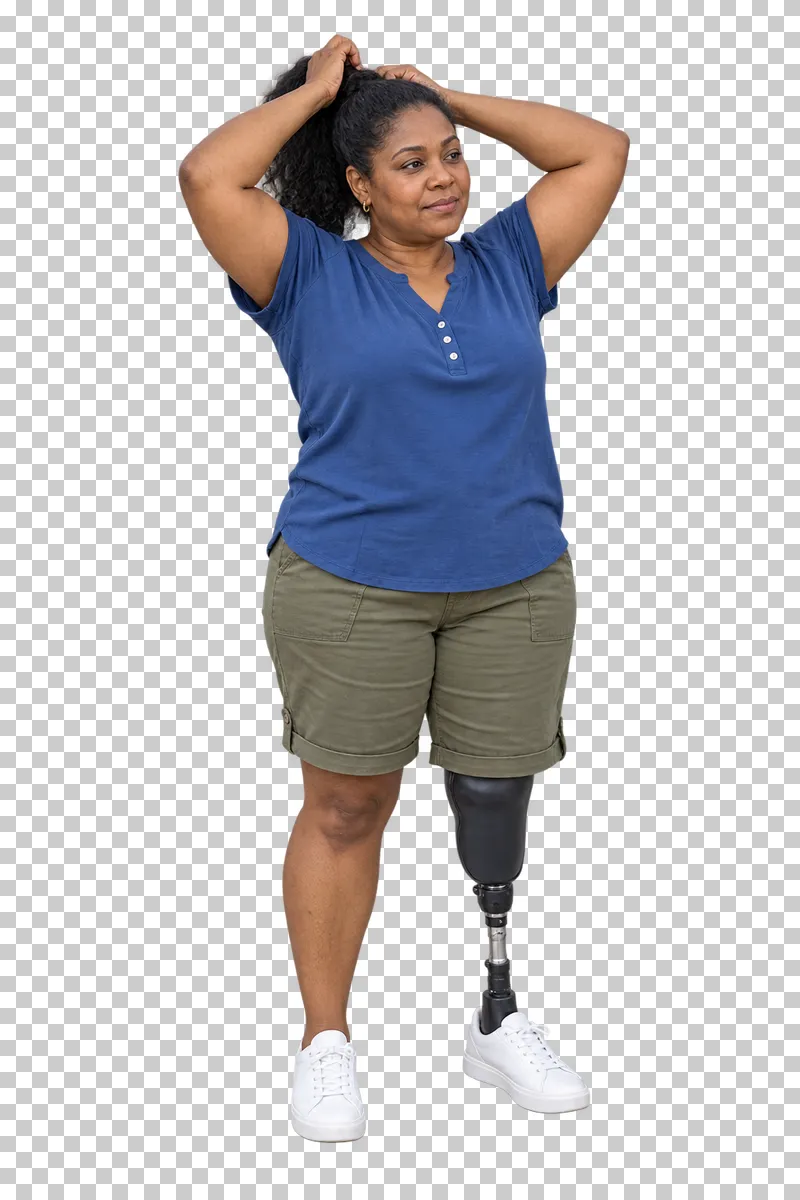 A woman with a below-knee prosthesis tying her hair.