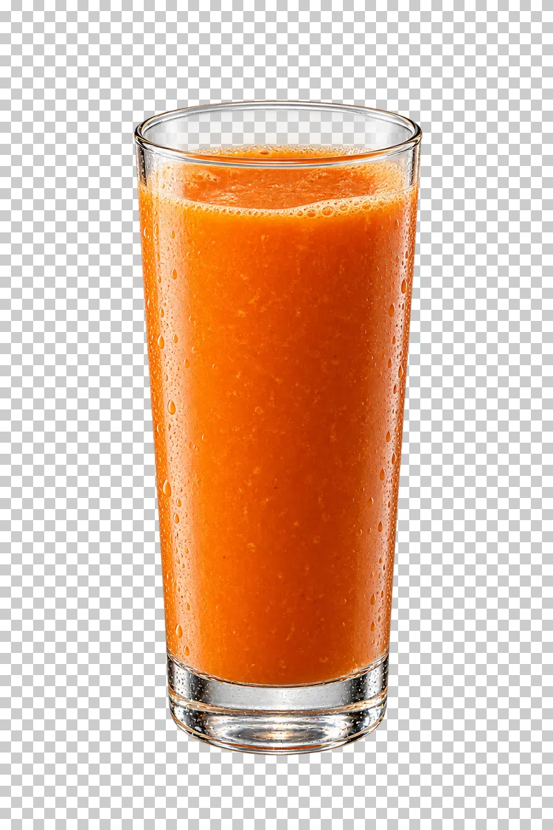 Thick orange carrot juice in a tall glass with a smooth surface.
