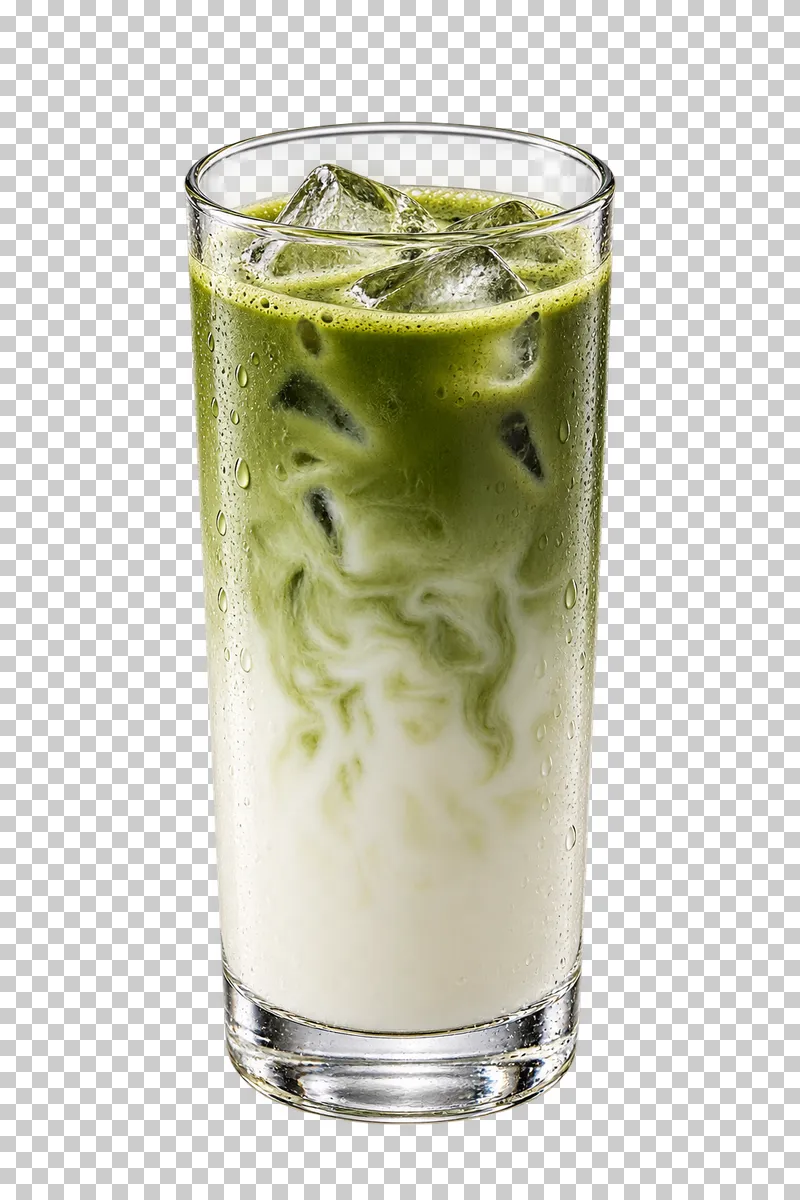 Iced matcha latte with green matcha above white milk and ice in a tall glass.