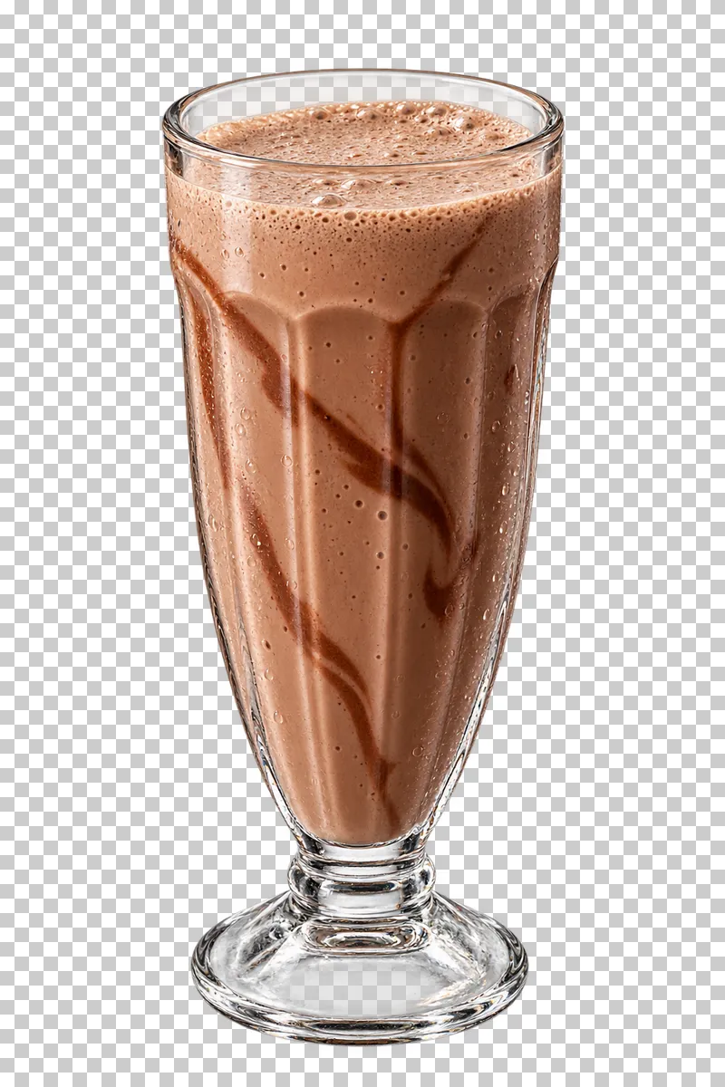 Chocolate milkshake with brown swirls and foam in a fluted footed glass.