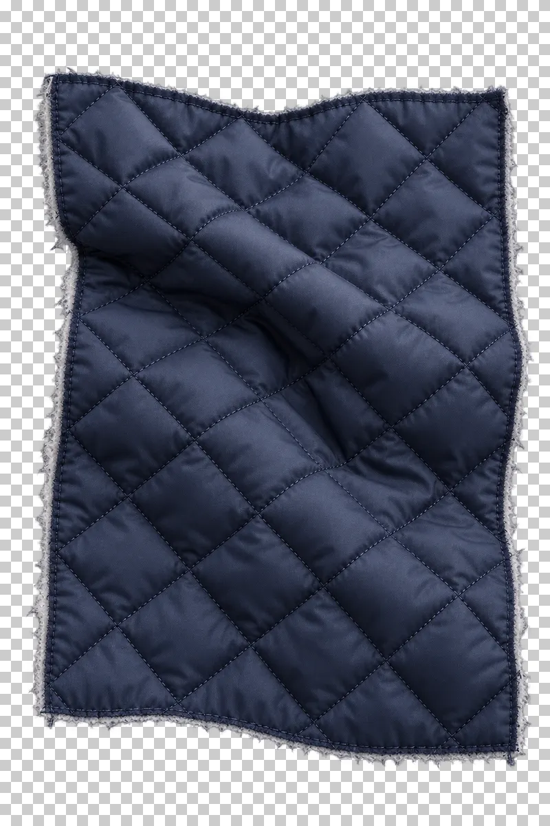 Quilted insulated fabric swatch in navy, arranged as loose drape with raised quilted sections, with visible textile structure and transparent surroundings.