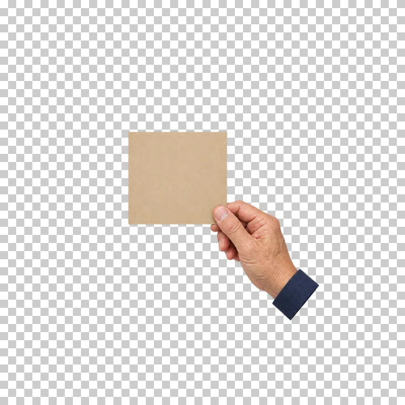 An older hand holding a blank square kraft card by its lower-right corner.