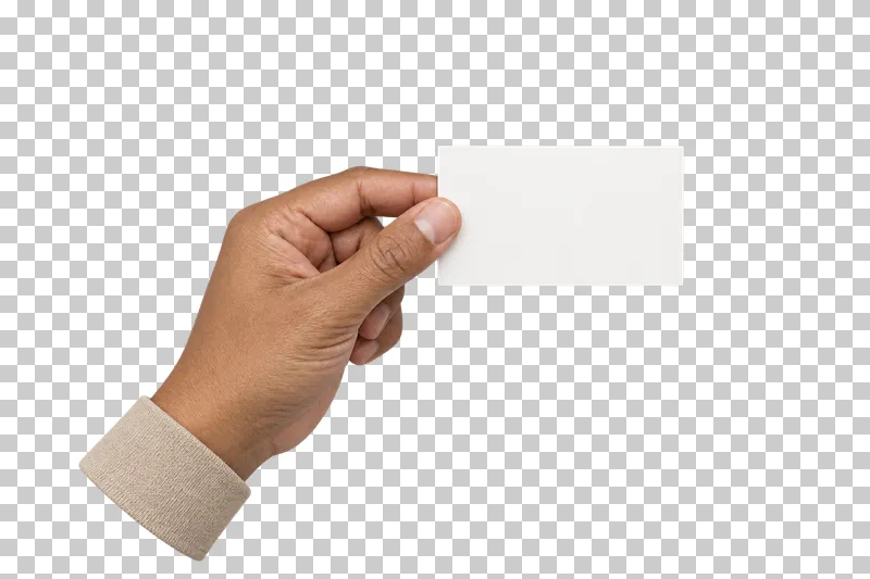 An adult hand pinching a small blank cream card between thumb and index finger.