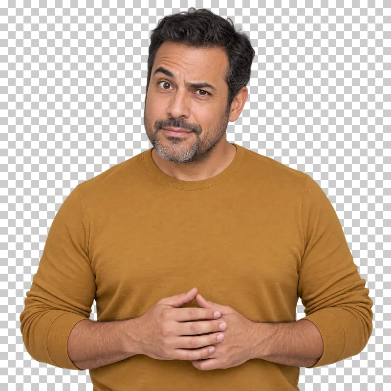 A man in an ochre top with one eyebrow raised in curiosity.