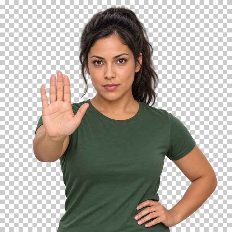 A dark-haired woman in a green T-shirt holding an open palm toward the camera in a stop gesture.