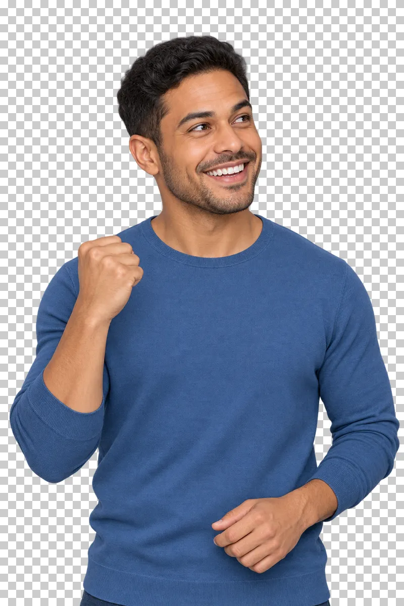 A young man in a blue top smiling with one clenched fist beside his chest.