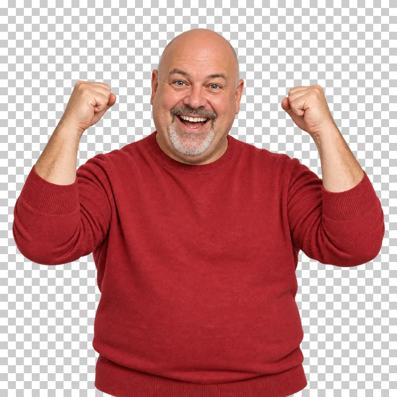 A bald man with a grey goatee in a red sweater raising both fists in a joyful victory gesture.