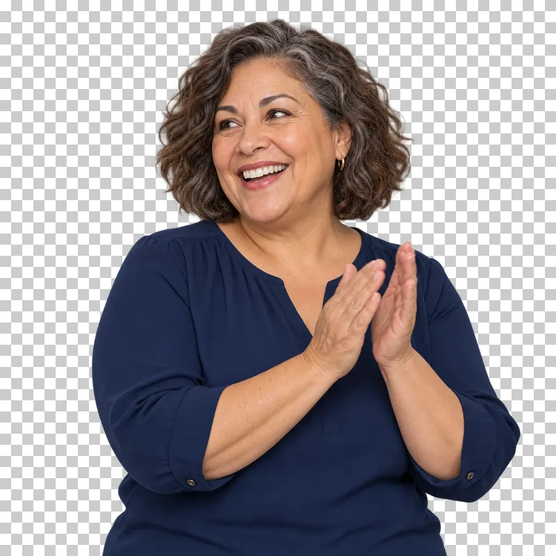A woman with brown-and-grey curls in a navy blouse smiling and applauding.