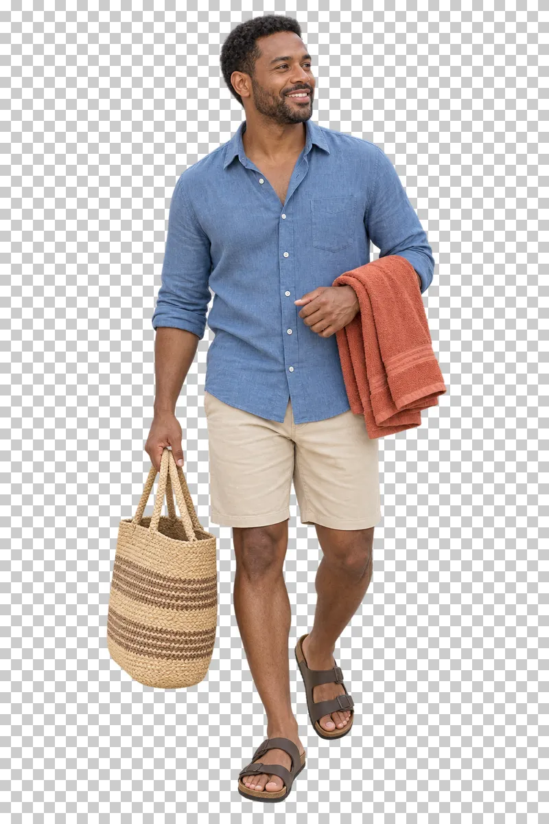 A holidaymaker carrying a folded towel and a woven beach bag.