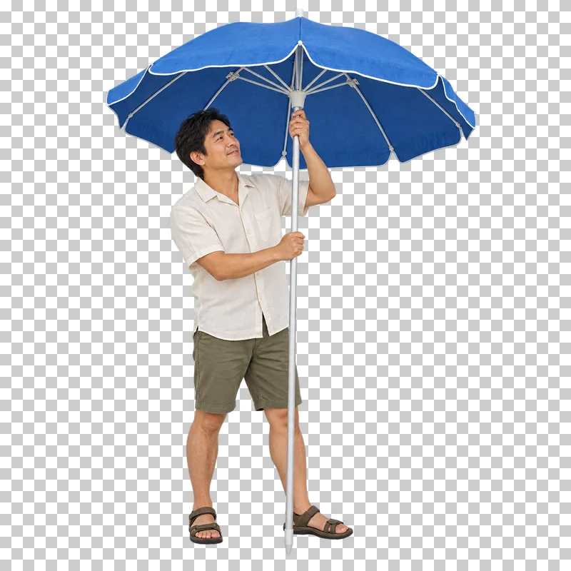 A holidaymaker opening a complete beach umbrella by its runner.