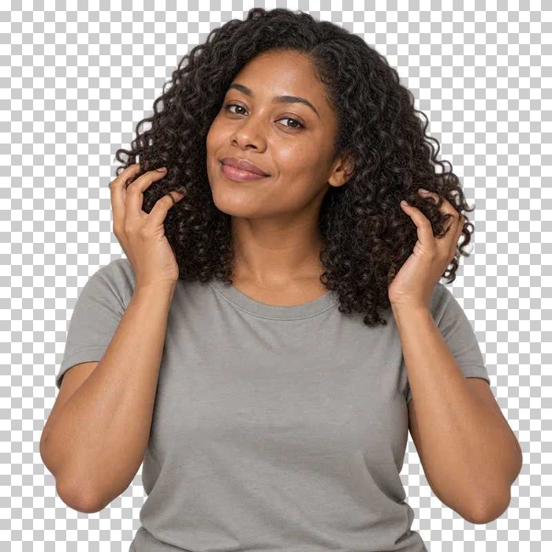 A person shapes curly hair with both hands.