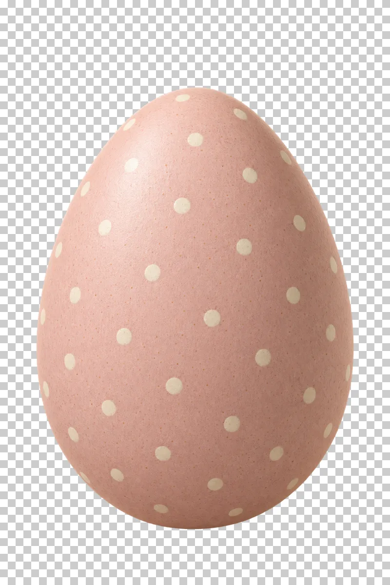 A cream ceramic Easter egg painted with tiny pastel dots.