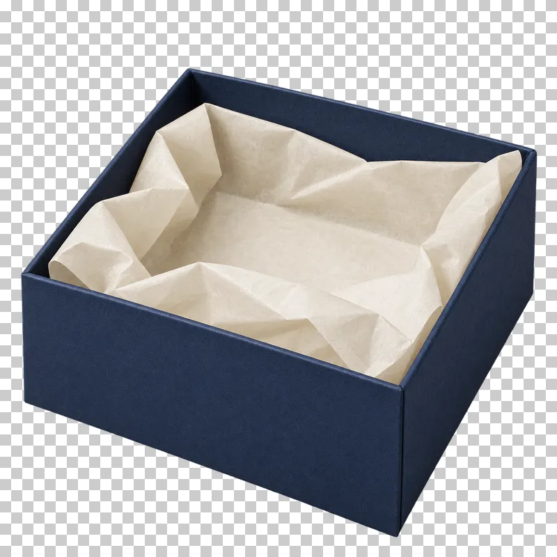Open navy gift box with cream tissue paper and opaque interior.