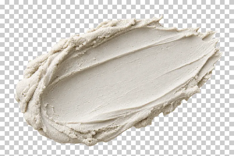 Off-white mineral clay paste with crumbly ridges.